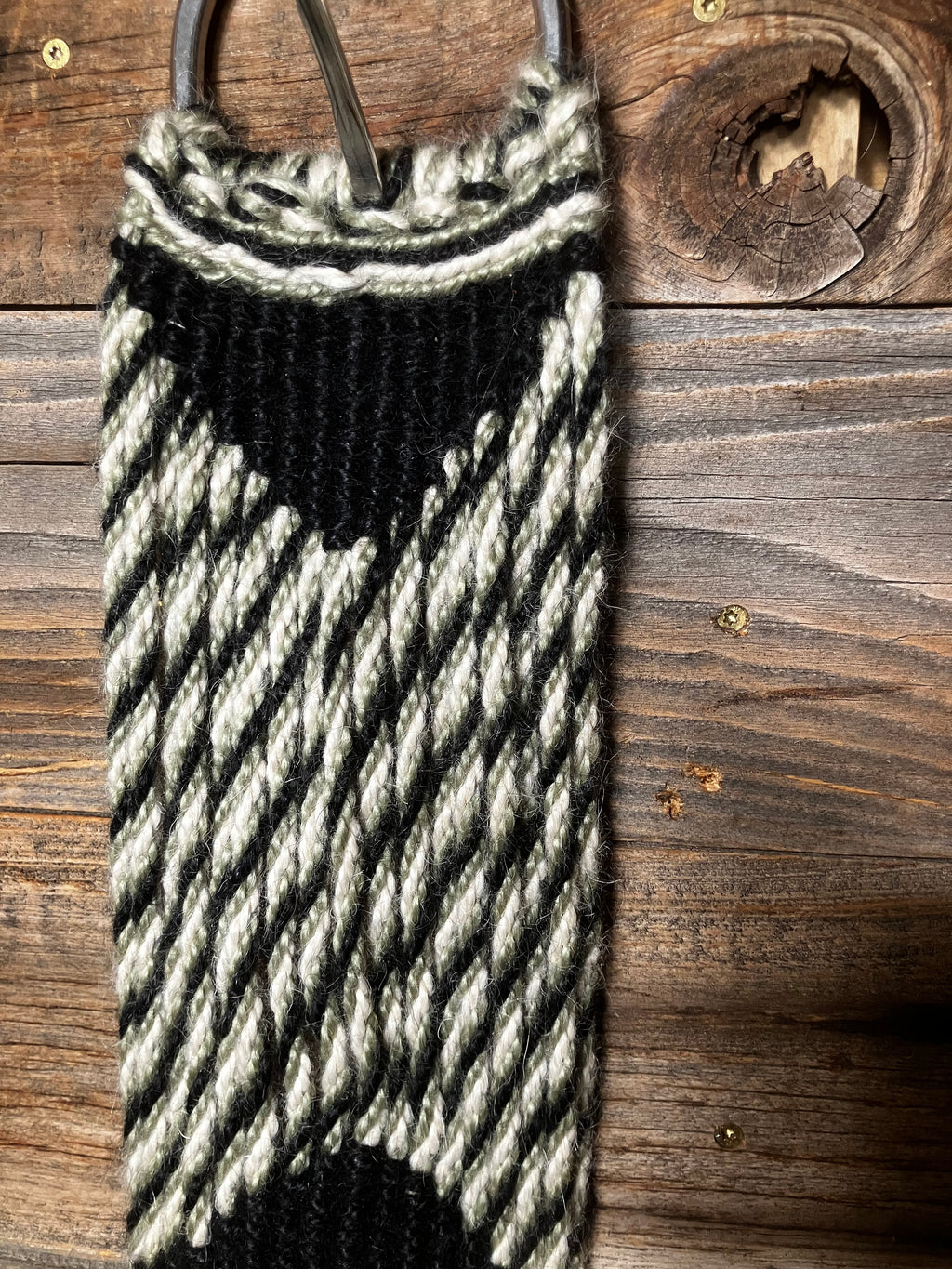 Green, black, and white cinch