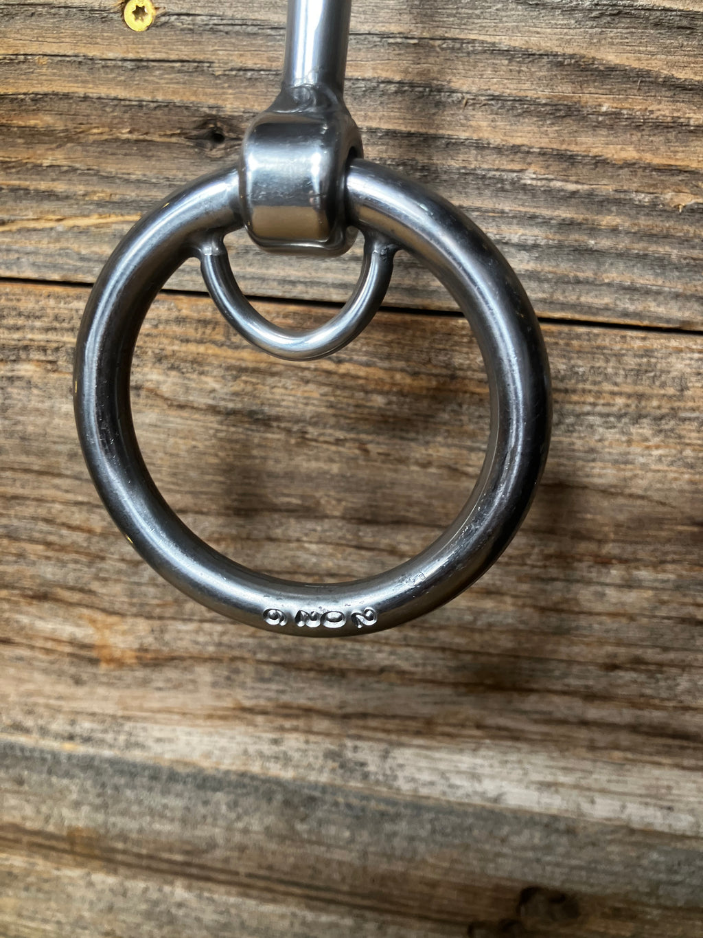 Locked ring curved smooth snaffle